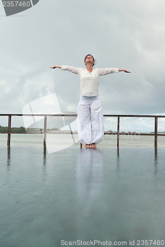 Image of young woman relax on cloudy summer day