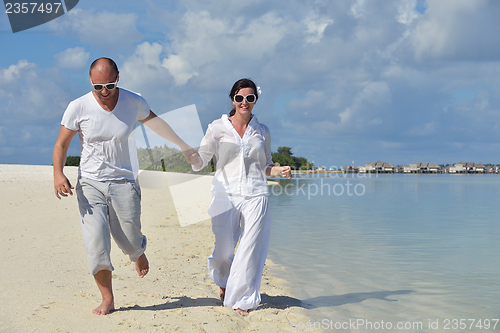 Image of happy young couple have fun on summer