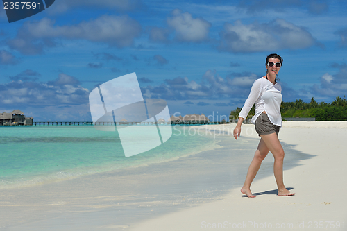 Image of happy young  couple at summer vacation have fun and relax at bea
