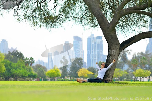 Image of woman with laptop in park