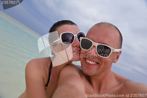 Image of happy young  couple at summer vacation have fun and relax at bea