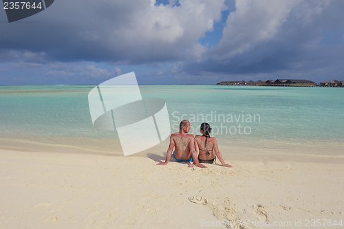 Image of happy young  couple at summer vacation have fun and relax at bea