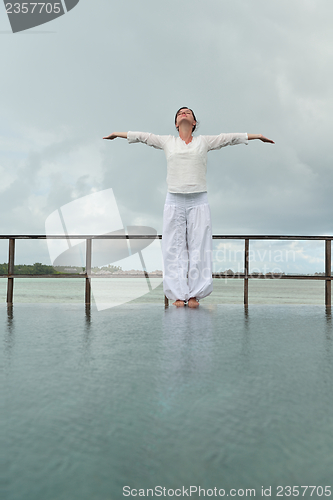 Image of young woman relax on cloudy summer day