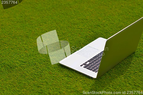 Image of laptop computer  on grass