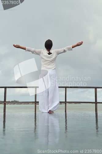 Image of young woman relax on cloudy summer day