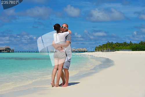 Image of happy young  couple at summer vacation have fun and relax at bea