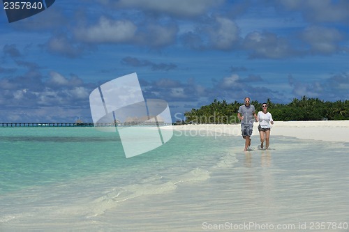 Image of happy young  couple at summer vacation have fun and relax at bea
