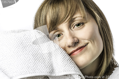 Image of Young girl snuggled in towel