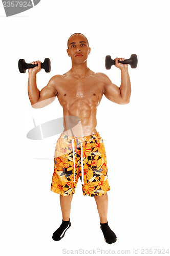 Image of Guy holding dumbbell.