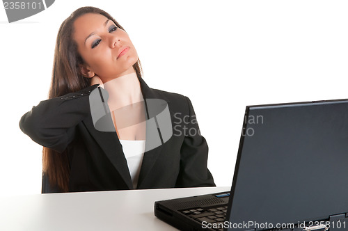 Image of Businesswoman Sitting at Her Desk Tired