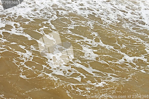 Image of Foamy seawater surface after the storm