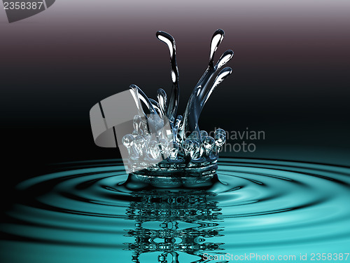 Image of Blue liquid splashes and water crown on surface