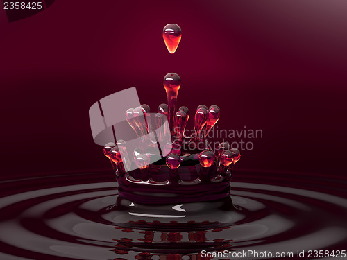 Image of Splash of red colorful fluid or wine with droplets