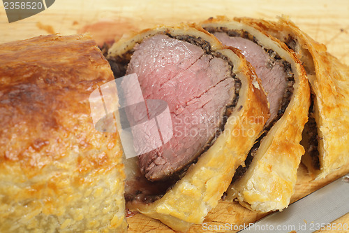 Image of Beef Wellington slices on a board
