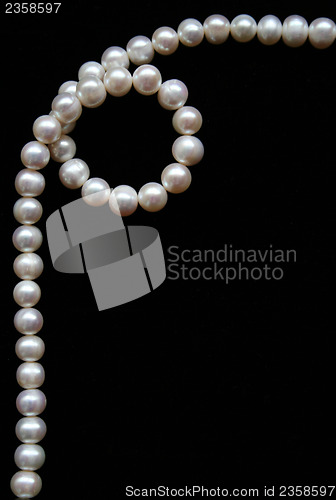 Image of White pearls on the black velvet