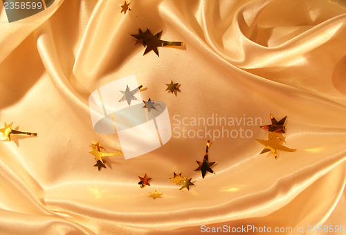 Image of New year holiday golden silk as background 