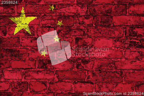Image of Chinese flag on brick wall