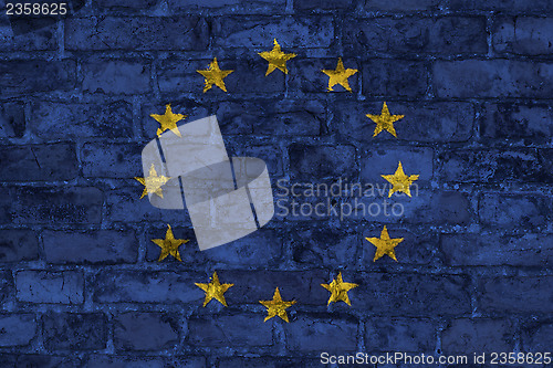 Image of EU flag on brick wall