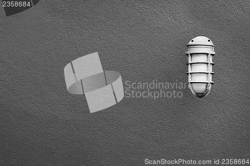 Image of Simple lantern on the a gray wall