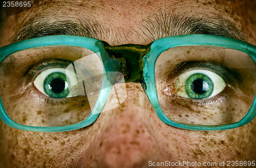 Image of Frightened look of a man in old glasses