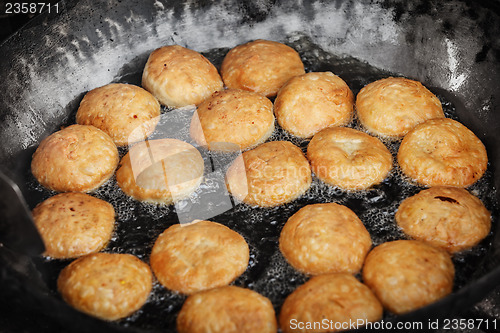 Image of Indian pastries in a pan on the open market