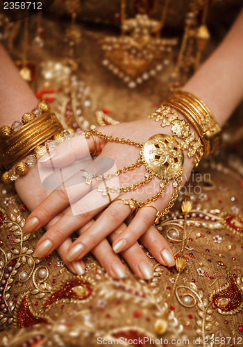 Image of Hands of a bride in a traditional wedding jewelry. Sri Lanka