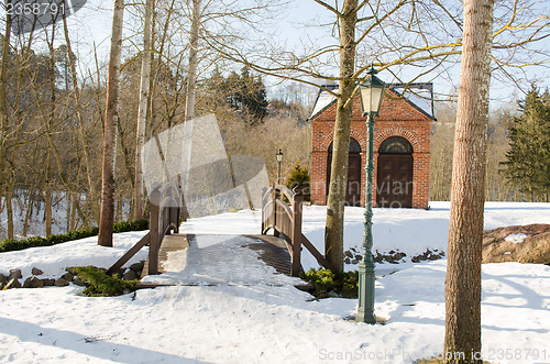 Image of park bridge brook retro lighting house snow winter 