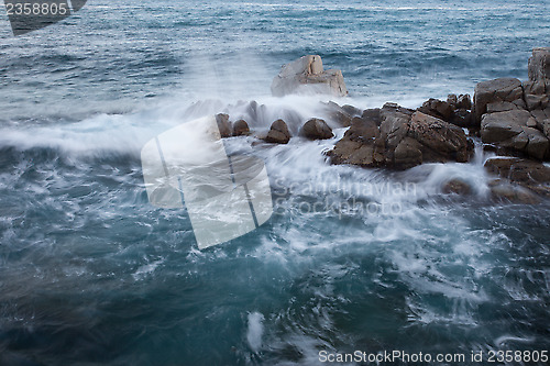 Image of wave and rock