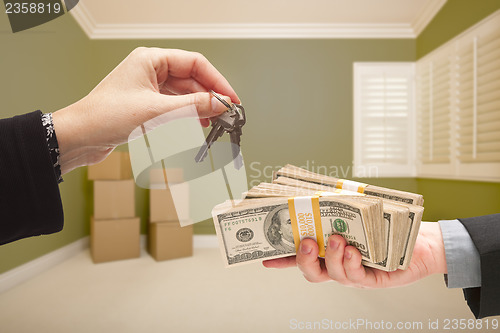 Image of Woman Handing Over Cash For House Keys