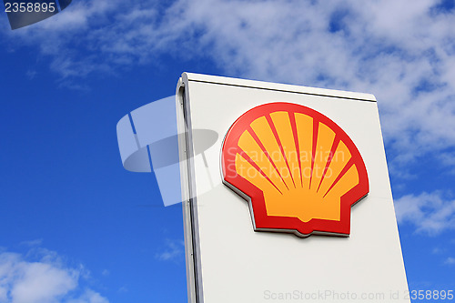 Image of Sign Shell against Blue Sky
