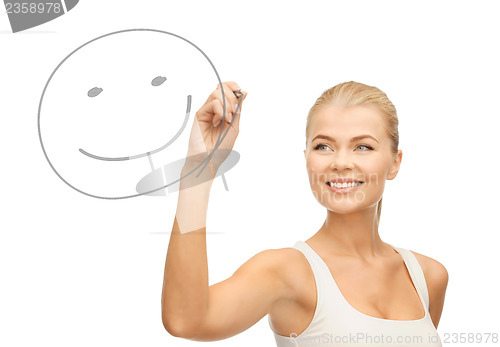 Image of woman drawing happy face