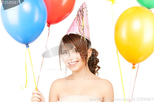 Image of happy girl with colorful balloons