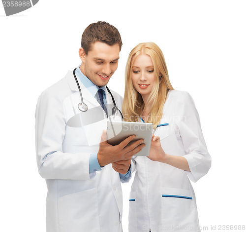 Image of young doctors working with tablet pc