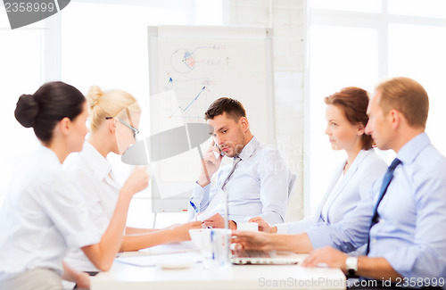 Image of stressed male boss on business meeting