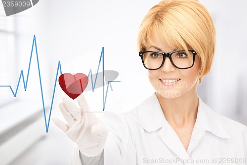 Image of doctor pressing virtual button with heart diagram