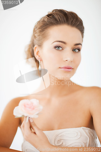 Image of woman with diamond earrings