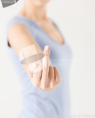 Image of woman showing middle finger