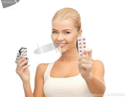 Image of young woman with pills