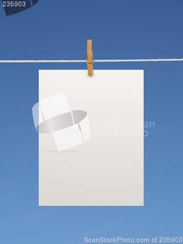 Image of Blank paper sheet on a clothes line (+2 clipping paths)