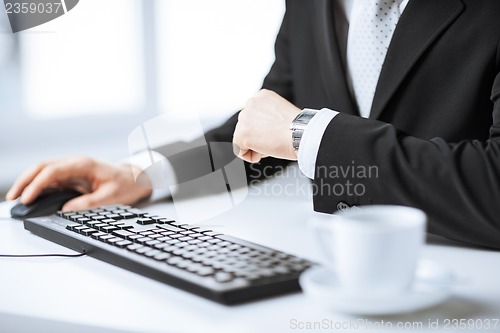 Image of man hands typing on keyboard