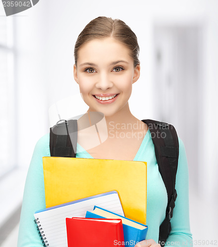 Image of student with books and schoolbag