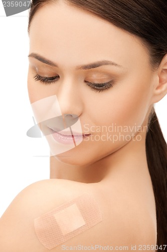 Image of beautiful woman with medical patch or plaster