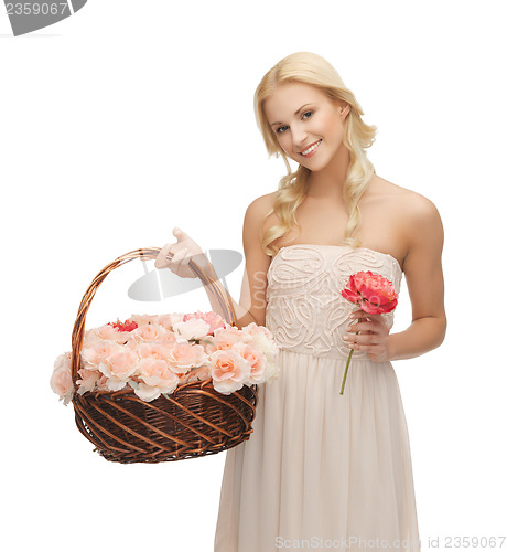 Image of woman with basket full of flowers