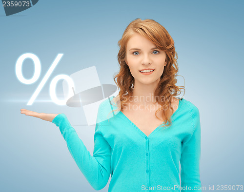 Image of girl showing sign of percent in her hand