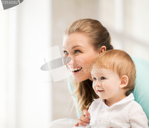 Image of happy mother with adorable baby