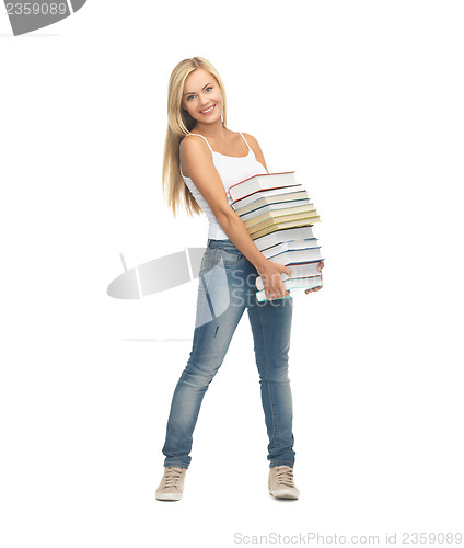 Image of student with stack of books