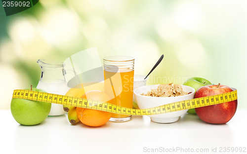 Image of healthy breakfast and measuring tape