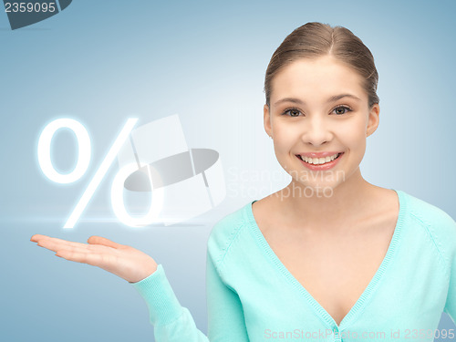 Image of girl showing sign of percent in her hand