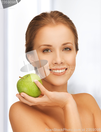 Image of smiling woman with an apple