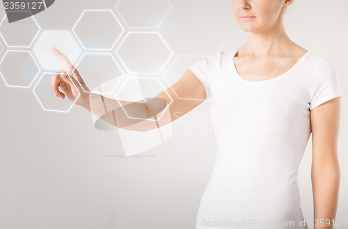 Image of woman hand pressing virtual button